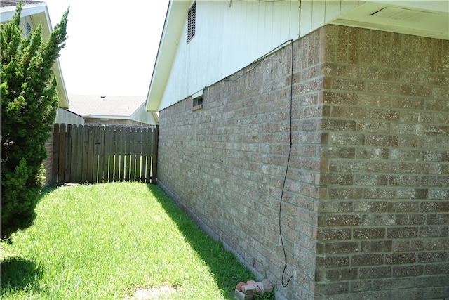 view of property exterior featuring a lawn