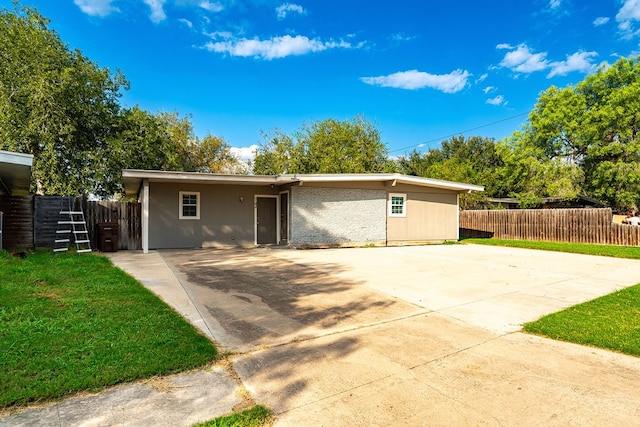 exterior space featuring a patio and a front lawn