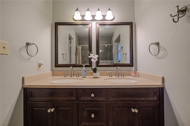 bathroom featuring walk in shower and vanity