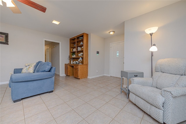 living room with ceiling fan and light tile patterned flooring