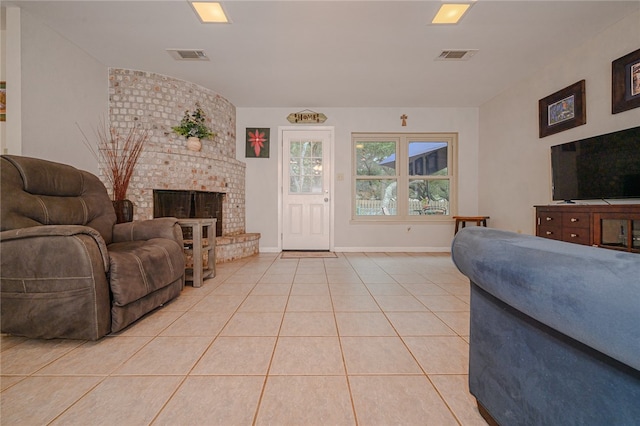 tiled living room with a fireplace