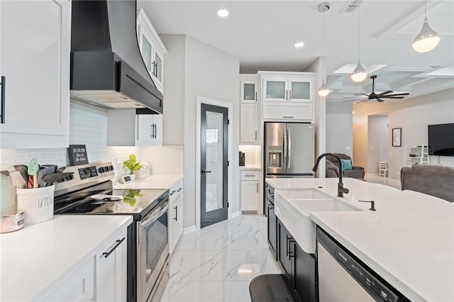102 Prestwick Dr, Portland, TX 78374 - kitchen featuring a sink, a ceiling fan, marble finish floor, wall chimney range hood, and appliances with stainless steel finishes