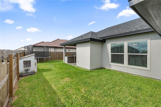 102 Prestwick Dr, Portland, TX 78374 - view of yard with a fenced backyard and a trampoline