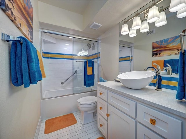 6649 Seacomber Dr Unit 1007, Port Aransas, TX 78373 - full bath with vanity, toilet, enclosed tub / shower combo, and tile patterned flooring