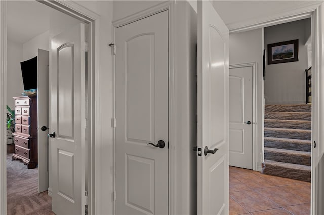 corridor with light tile patterned flooring