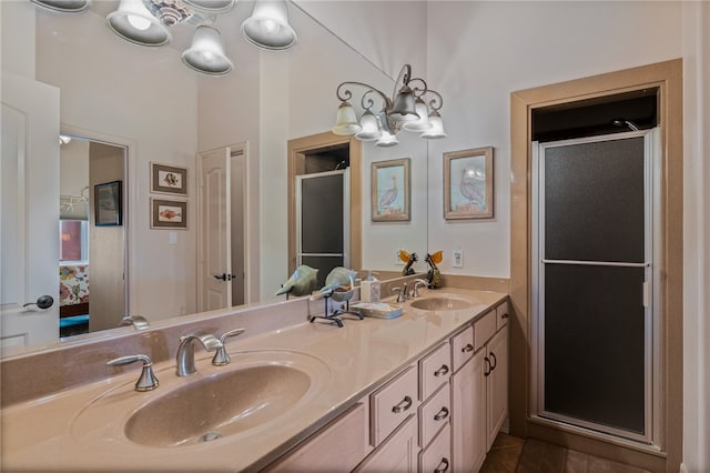 bathroom featuring walk in shower, vanity, and a chandelier