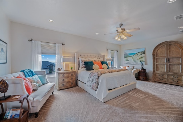 bedroom featuring light carpet and ceiling fan