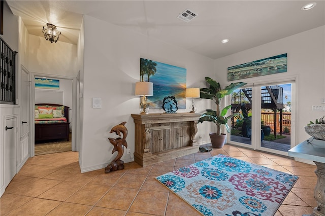 interior space with an inviting chandelier and light tile patterned floors