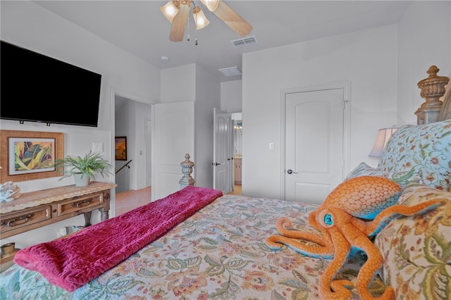 bedroom with ceiling fan and light tile patterned flooring