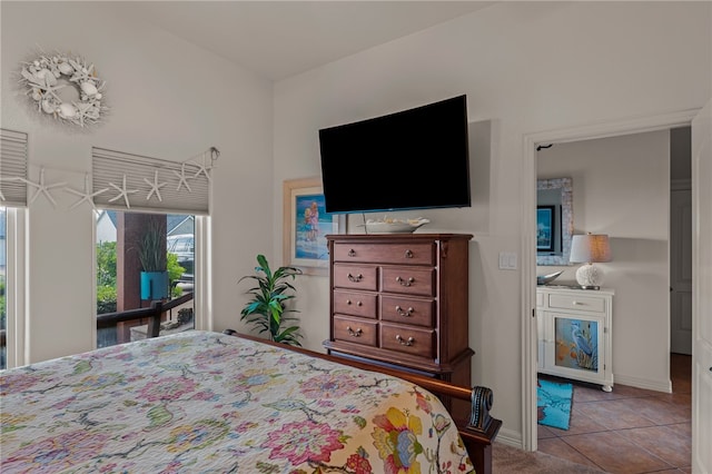 tiled bedroom featuring access to outside