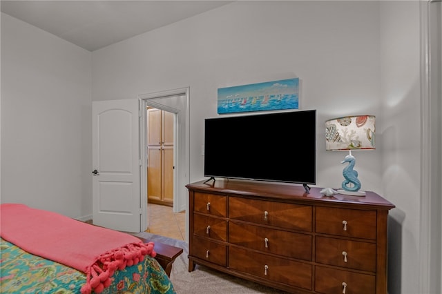 bedroom featuring light colored carpet