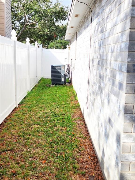 view of yard with central AC