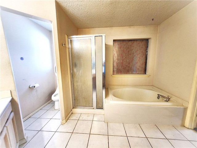 full bathroom featuring vanity, a textured ceiling, separate shower and tub, tile patterned flooring, and toilet