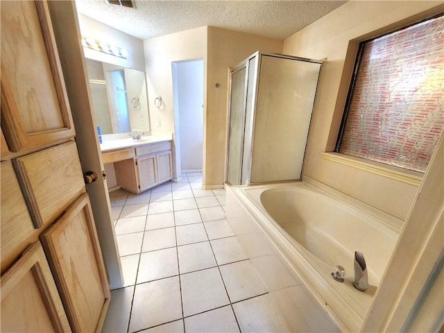2210 Dorsey St, Corpus Christi, TX 78414 - full bath featuring a shower stall, tile patterned flooring, vanity, a garden tub, and a textured ceiling