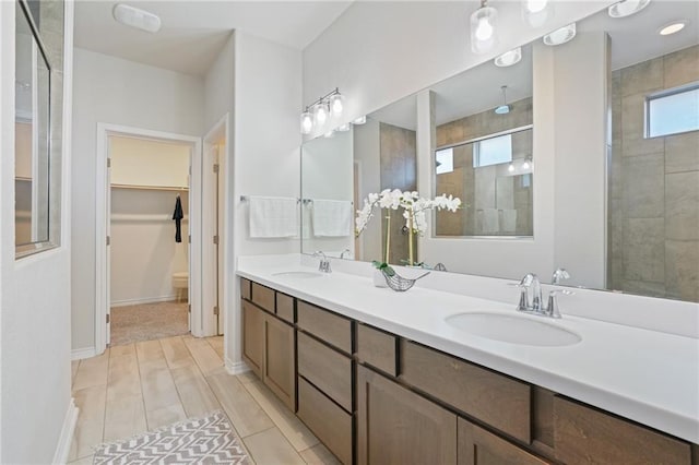 bathroom with vanity and a shower with shower door