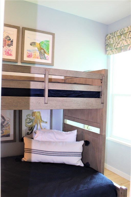 bedroom with wood-type flooring