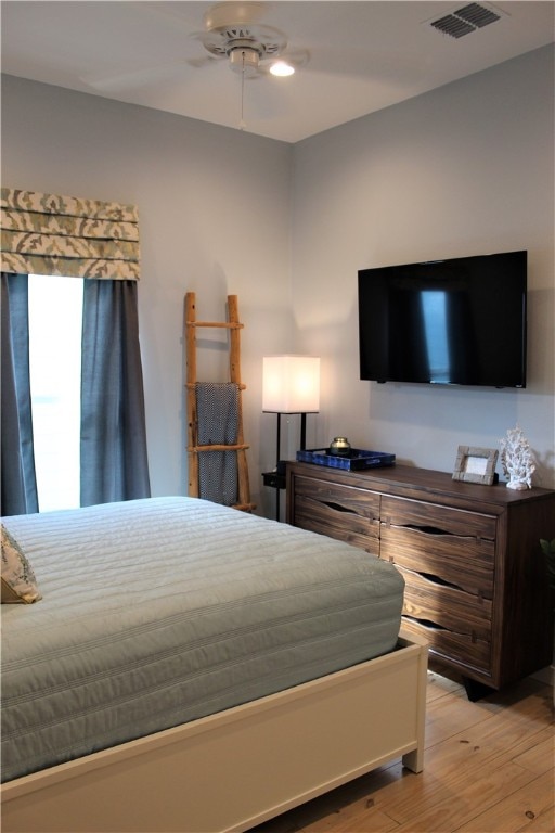 bedroom featuring ceiling fan and light wood-type flooring