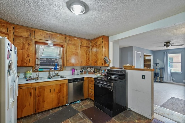 kitchen featuring black range with electric stovetop, a sink, stainless steel dishwasher, white fridge with ice dispenser, and brown cabinetry