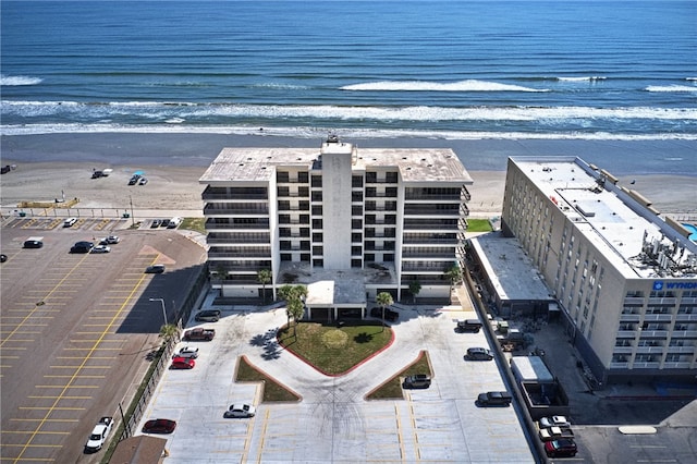 bird's eye view featuring a view of the beach and a water view