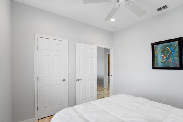 bedroom featuring ceiling fan and light hardwood / wood-style flooring