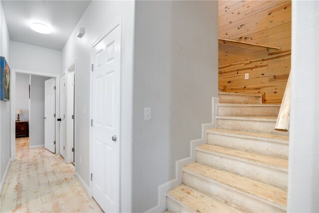 stairway with hardwood / wood-style flooring