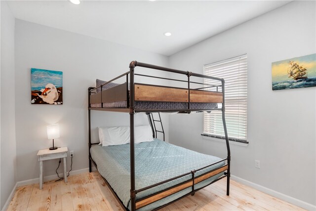 bedroom with light hardwood / wood-style flooring