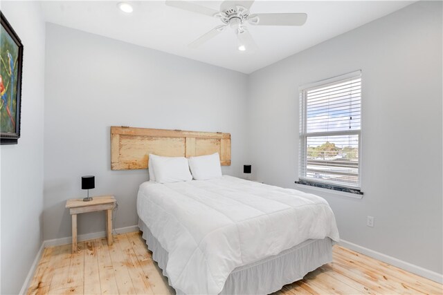 bedroom featuring ceiling fan and light wood-type flooring