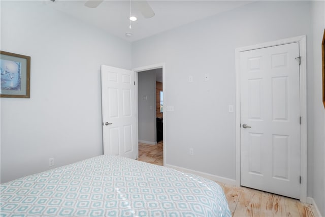 bedroom featuring light wood-type flooring and ceiling fan