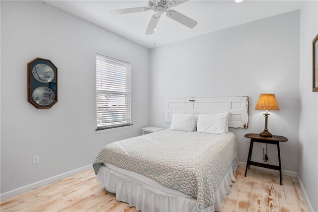 bedroom with ceiling fan and light wood-type flooring