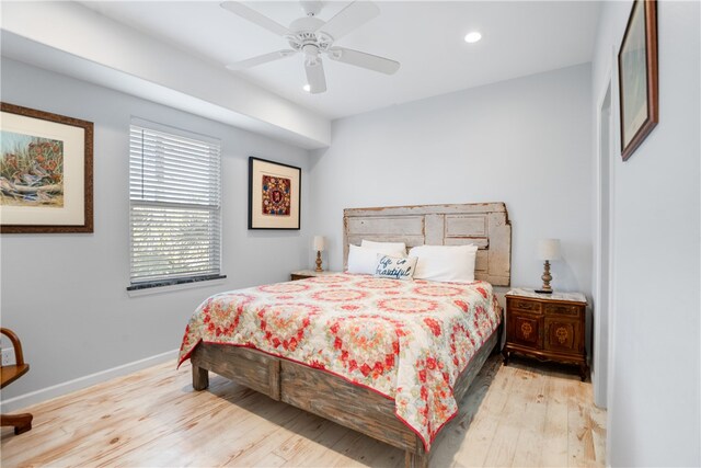 bedroom featuring ceiling fan and light hardwood / wood-style flooring