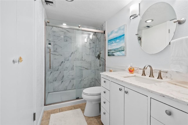 4000 Surfside Blvd Unit 403, Corpus Christi, TX 78402 - full bathroom with vanity, a marble finish shower, toilet, tile patterned floors, and a textured ceiling
