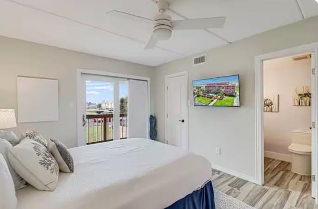 bedroom with access to exterior, light wood-type flooring, baseboards, visible vents, and ensuite bath