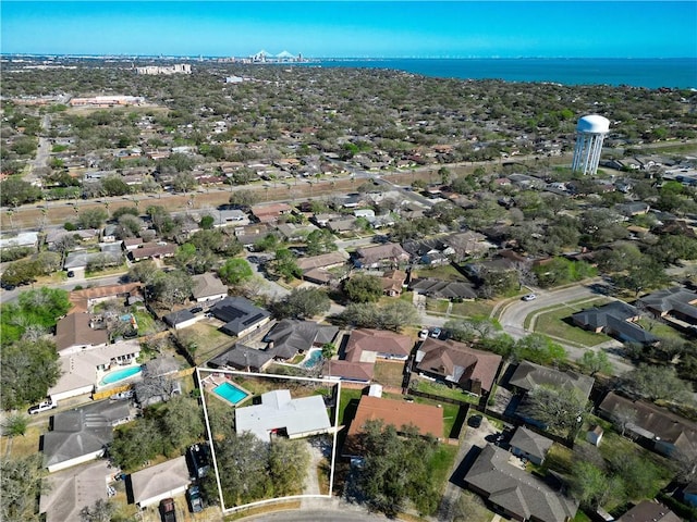 drone / aerial view with a residential view and a water view