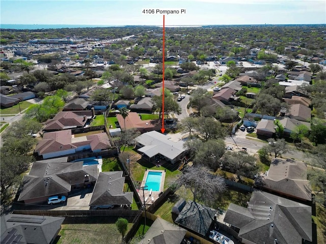 birds eye view of property with a residential view