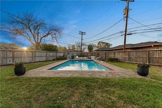 view of pool featuring a lawn, a fenced backyard, and a fenced in pool