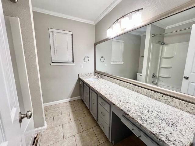 bathroom with tile patterned flooring, vanity, tub / shower combination, and crown molding