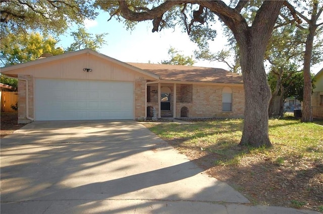 ranch-style house featuring a garage