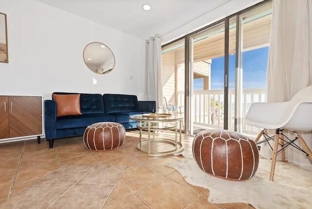 living area with tile patterned floors