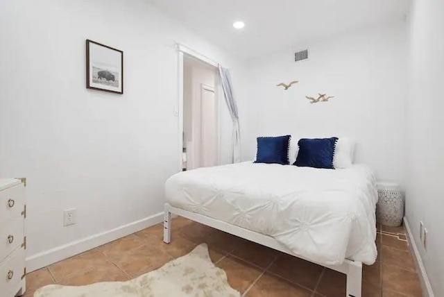 3938 Surfside Blvd Unit 1212, Corpus Christi, TX 78402 - bedroom with tile patterned floors, baseboards, and recessed lighting