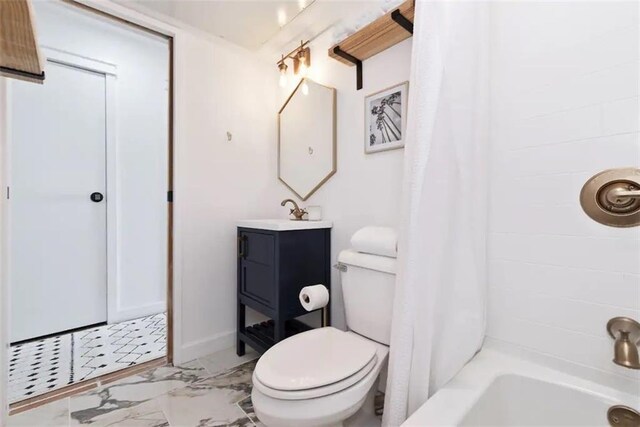3938 Surfside Blvd Unit 1212, Corpus Christi, TX 78402 - full bath featuring vanity, toilet, marble finish flooring, and shower / tub combo