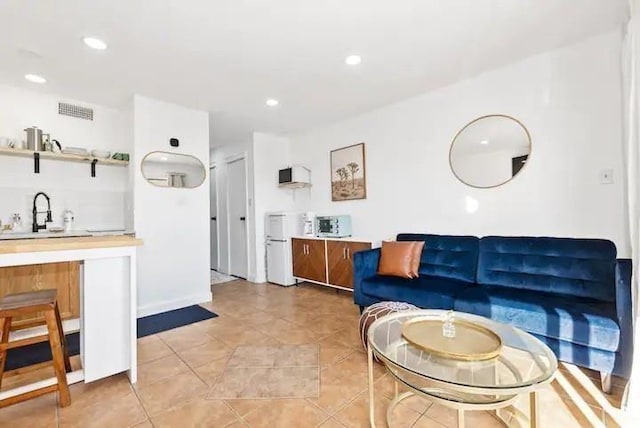 3938 Surfside Blvd Unit 1212, Corpus Christi, TX 78402 - living room featuring recessed lighting and light tile patterned floors