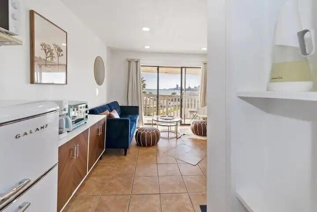 living area with light tile patterned floors