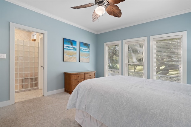 bedroom featuring ornamental molding, ensuite bath, light carpet, and ceiling fan