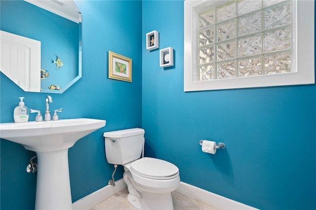 bathroom with tile patterned floors and toilet