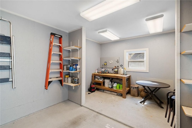 10 Old Cottage Beach Dr, Rockport, TX 78382 - miscellaneous room featuring concrete flooring, a workshop area, and crown molding