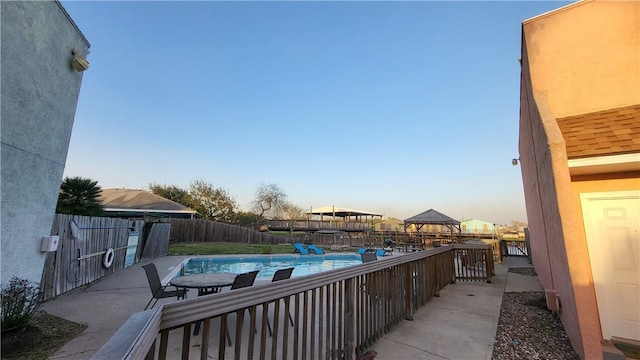 view of patio / terrace with a fenced backyard and a fenced in pool