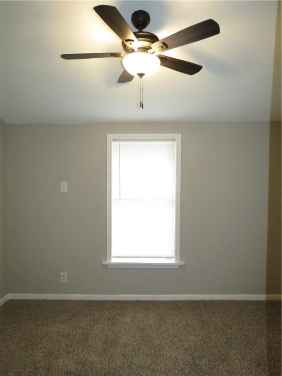 carpeted empty room with ceiling fan