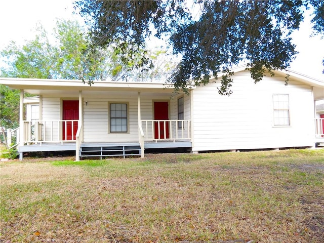 view of front of property with a front yard and a porch