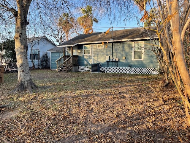 back of property with central AC unit