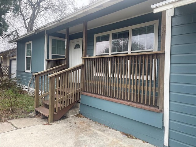 doorway to property featuring covered porch